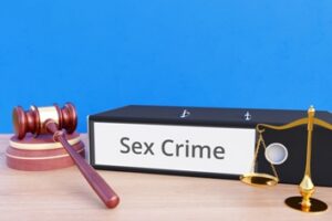 Sex Crimes Folder With a Gavel and Scales of Justice Izquierdo Law Firm